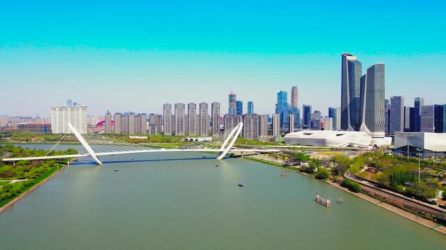 Aerial View of Zhengzhou City Skyline and White Bridge Over River in Henan, China in Zhengzhou, Henan, China