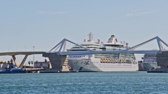zoomed in shot of giant cruise ship at port vell barcelona