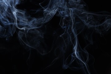 Obraz premium Beautiful smoke in light on black background