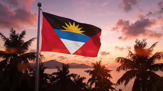 Antigua flag waving on flagpole at tropical beach sunset