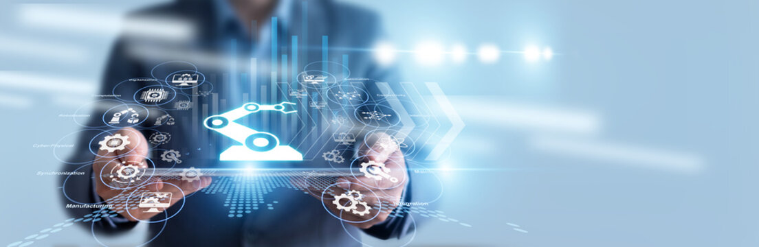 Factory manager hold tablet and monitors smart sensors for Industry 4.0 implementation, reviewing real-time automated production data. Smart factories revolutionize modern manufacturing.