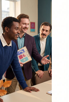Group of men discussing ideas in an office setting  