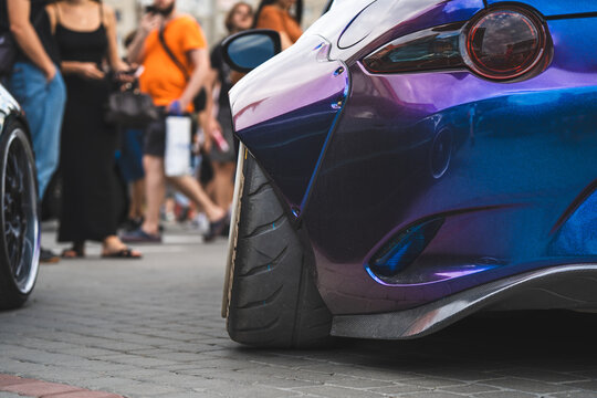 Tuned Sport Car with Wide Body Kit Fender Flares and Stance Custom Wheels
