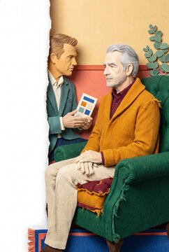 Two men discussing prostate health in a colorful living room  