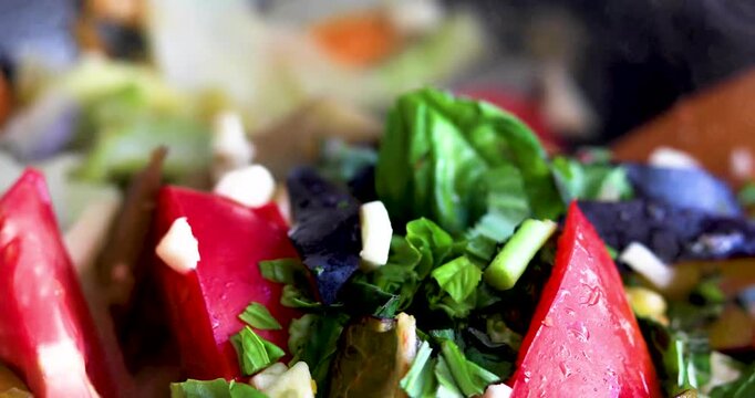 Stewing vegetables with tomatoes, basil, and garlic in a deep skillet; a healthy dinner