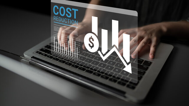 A person typing on a laptop with a digital overlay showcasing cost reduction elements, including financial graphs and statistics that highlight business insights and strategies. Ledger
