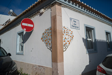 Rua dos Ferreiros street sign with orange tree mural in Lagos Portugal © Tomas Bazant