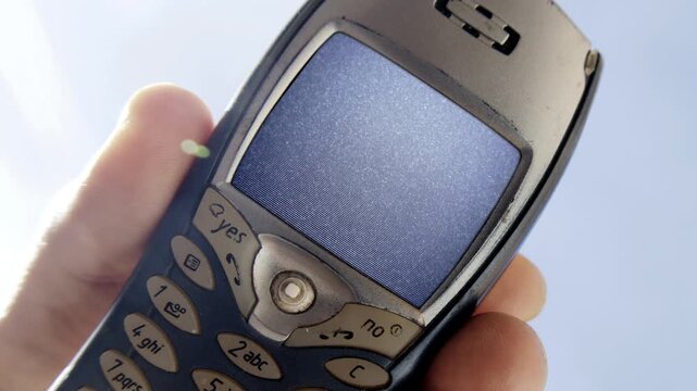 mobile telephone in hand with glitch on screen