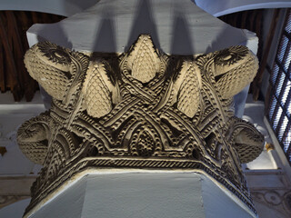 Ornate Carved Stone Column Capital - Intricately carved stone column capital features detailed geometric and organic patterns, highlighting the craftsmanship and architectural b © jmag.foto