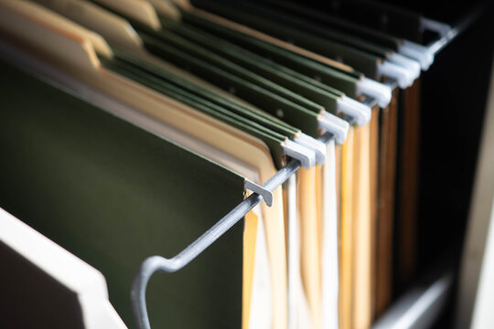 Office space file folders cabinet searching for documents, textured backgrounds copy space, bokeh abstract close up