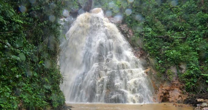 Waterfall on a dangerously flooded river in the Amazon. Rio Narupayacu at 1,200m elevation in the Amazonian foothills of the Andes in Napo province, Ecuador