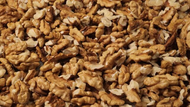 Shelled walnut kernels food background dolly shot