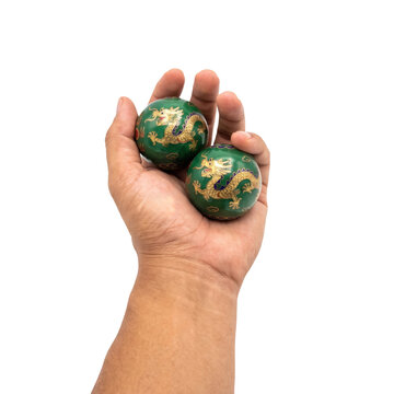 Rotating baoding health balls in hand isolated on a transparent or white background. Traditional chinese relaxation practice and stress relief therapy, mental wellness.