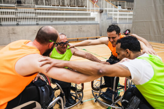 Wheelchair basketball team huddling for motivation