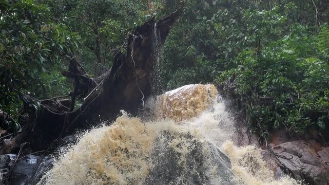Waterfall in slow motion on a dangerously flooded river in the Amazon. Rio Narupayacu at 1,200m elevation in the Amazonian foothills of the Andes in Napo province, Ecuador