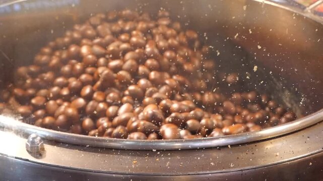 Slow motion Asian roasted chestnuts