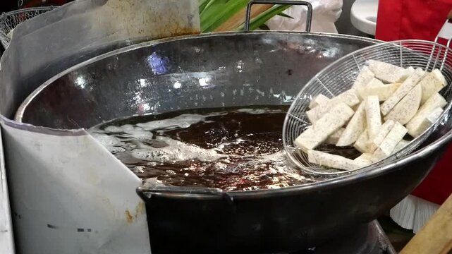 Deep frying taro by cooking oil