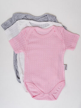 Folded grey knit bodysuit flat lay