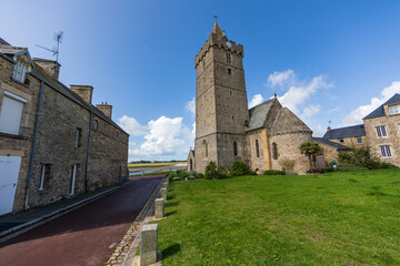 Fototapeta premium Stone Tower and Green Field in Cotentin, Normandy