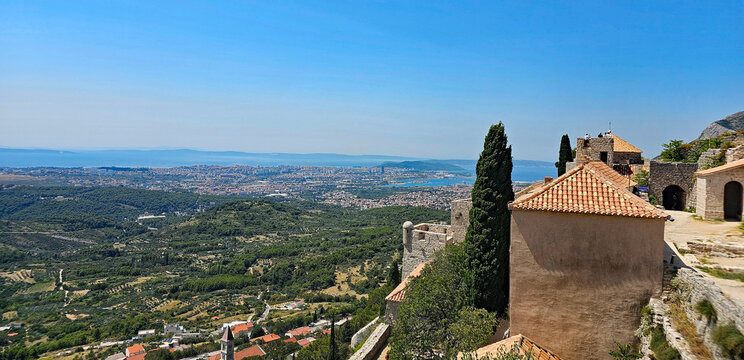 Wonderful photos of a stunning landscape in Croatia, featuring sweeping views, arid terrain, and endless expanses, with water, buildings, and Klis Castle near Split 