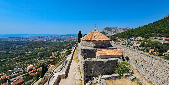 Wonderful photos of a stunning landscape in Croatia, featuring sweeping views, arid terrain, and endless expanses, with water, buildings, and Klis Castle near Split 