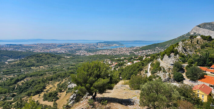 Wonderful photos of a stunning landscape in Croatia, featuring sweeping views, arid terrain, and endless expanses with water and buildings