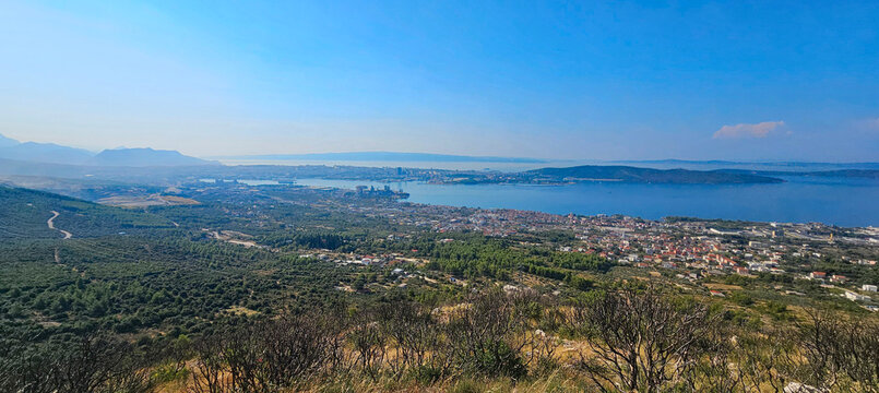 Wonderful photos of a stunning landscape in Croatia, featuring sweeping views, arid terrain, and endless expanses with water and buildings