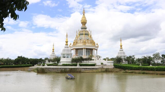 Scenic video views of sculptures set against beautiful skies at Wat Phra That Nong Waeg and Wat Thung Setthi in Khon Kaen, Thailand.
