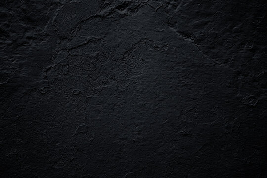  Textura de pared de hormig&oacute;n grunge pintado de negro oscuro. Fondo de superficie rugosa, oscura y s&oacute;lida; transmite sobriedad, misterio y minimalismo industrial.