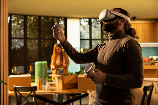 Homeowner using virtual reality to explore interior layout