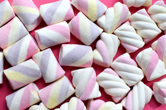Multi-colored marshmallows. Background or texture of colorful blue and pink marshmallows.