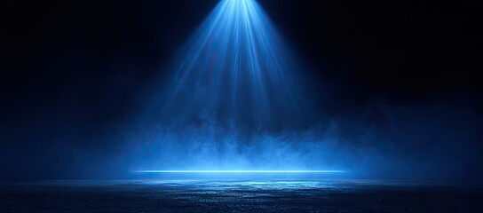 Obraz premium A vibrant blue spotlight cuts through dark atmospheric smoke on a textured floor