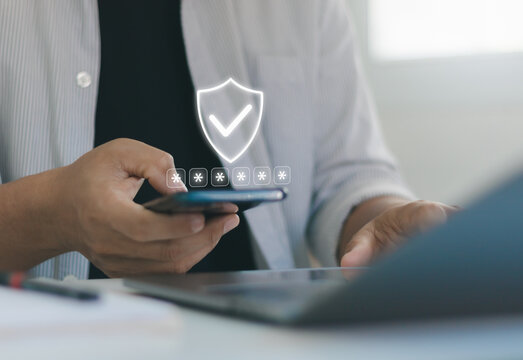 Person entering password on smartphone with shield icon secure login interface, representing OTP verification, MFA authentication, cyber security, identity protection, encrypted mobile access. 2FA.