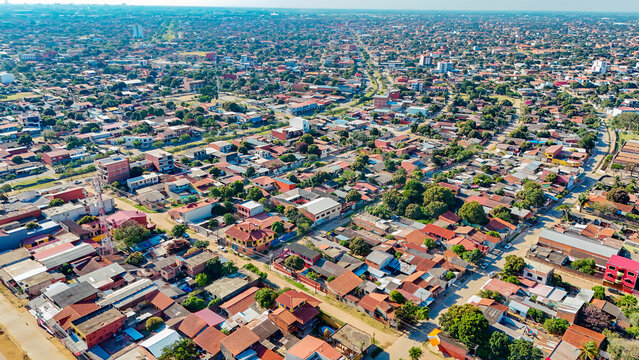 Aerial view of a densely populated urban zone with continuous housing and street grid in Santa Cruz, Bolivia.