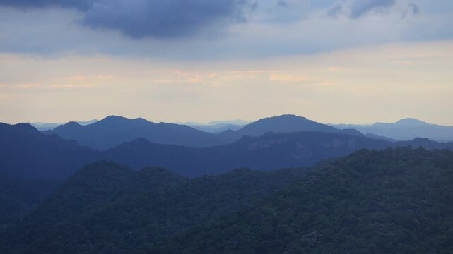 A panoramic video view from a high mountain, showcasing the stunning natural beauty of a complex, layered landscape of mountains of various sizes encountered during an adventure.