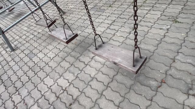 Vintage wooden playground swings