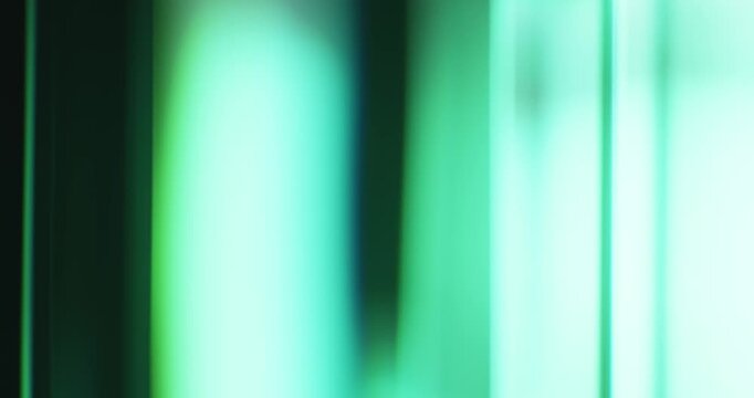 Rainbow of ethereal lights illuminate the brilliance of a smooth reflective glass prism. Colorful light refraction creating an aura of vivid saturated colors for a dreamy abstract background. Loop.