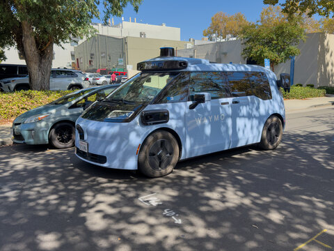 San Jose, California, USA - September, 12, 2026: A Waymo Ojai robotaxi van makes its way down a narrow street in the Willow Glen neighborhood of San Jose, California.
