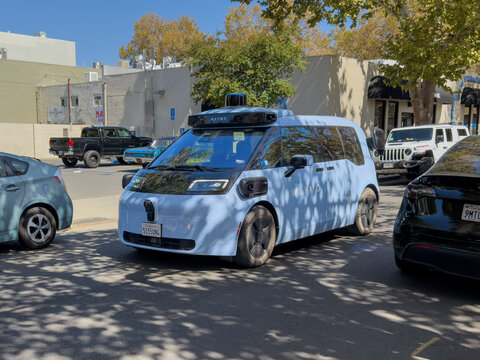 San Jose, California, USA - September, 12, 2026: A Waymo Ojai robotaxi van makes its way down a narrow street in the Willow Glen neighborhood of San Jose, California.
