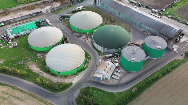 Drone shot of circular biogas digester tanks in eco friendly farm