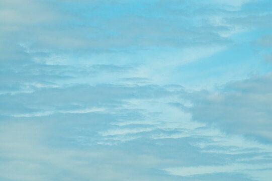The photo shows a blue sky and clouds