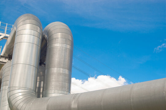 close-up of a pipeline against a blue sky