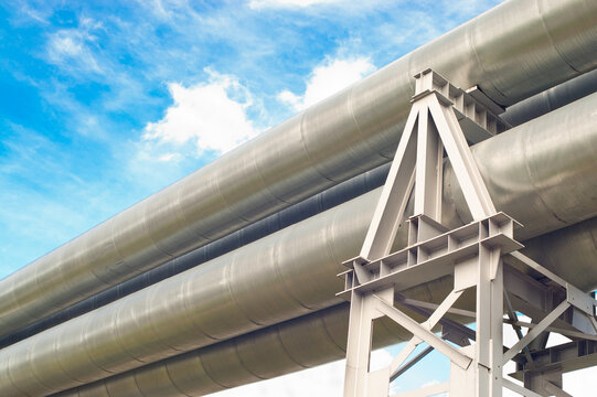 close-up of a pipeline against a blue sky