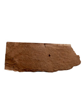 Dried ancient clay tablet with markings