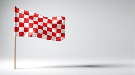 Obraz premium Red and white checkered flag waves on wooden pole. Symbolizes racing finish line victory, competition, start, end, achievement, success. Isolated graphic element for sport event.