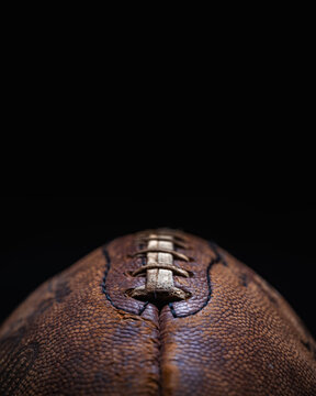 Macro Vintage American Football  Close Up on Black Background with Copy Space