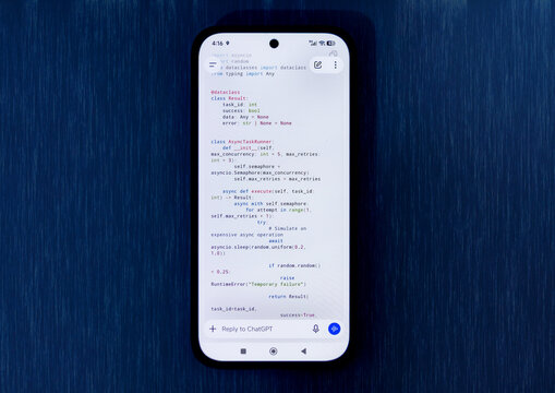 Close-Up Smartphone Displaying Python Async Programming Code on a Clean White Background