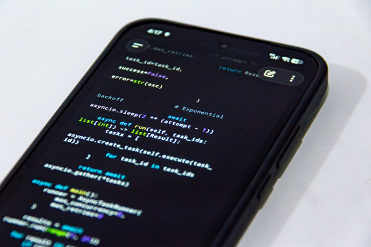 Close-Up Smartphone Displaying Python Async Programming Code on a Clean White Background