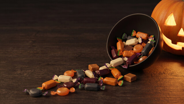 Halloween Candy Spilling from Bucket Beside Jack O Lantern