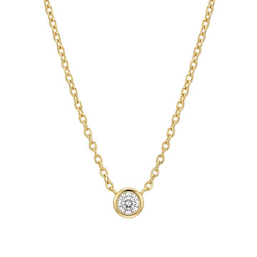 Single round diamond solitaire necklace on a delicate gold chain isolated